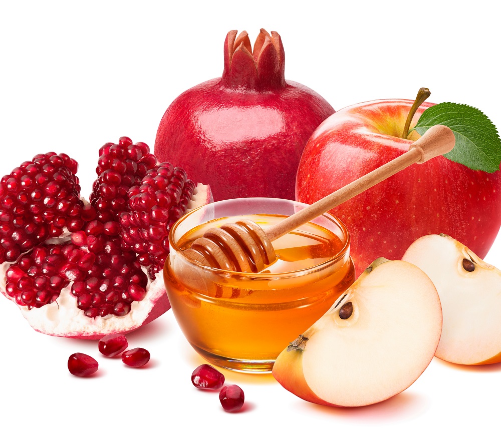 Photo of apples, pomegranates and honey.